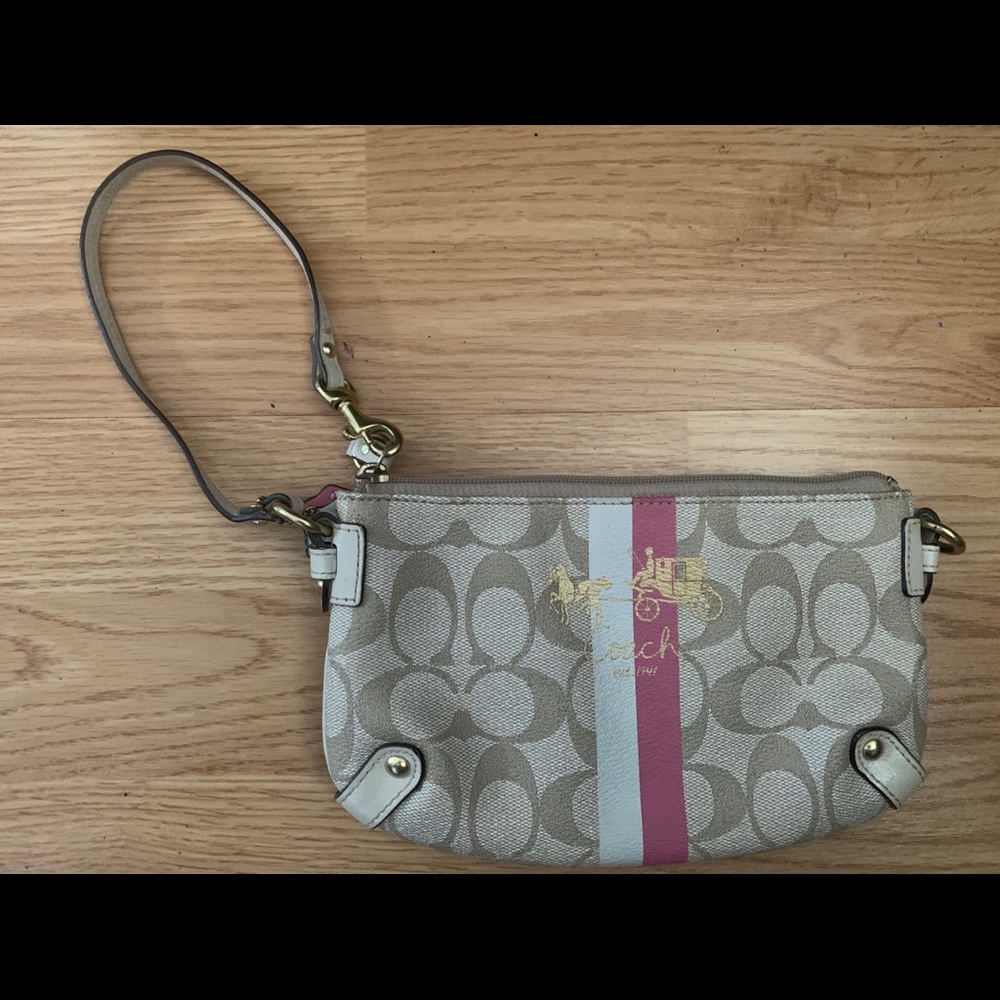 Coach wristlet with a pink and white line